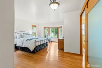 Hardwood continues into primary bedroom