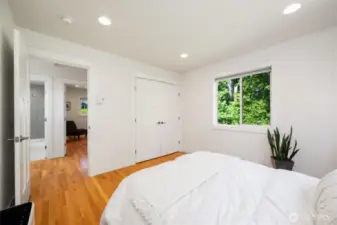 A custom closet system adds smart storage to the primary  bedroom.