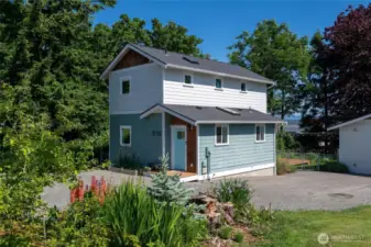 Vibrant landscaping surrounds the property.