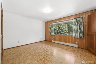 Primary bedroom with a one-half bath and a door that leads to a full bath.