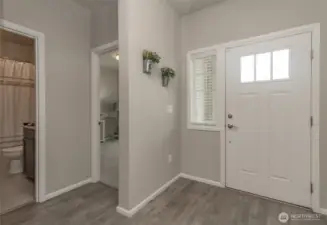 Another view of front entry with 2 bedrooms and a full bathroom on the left