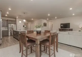 View from dining area into kitchen on left and living room on right