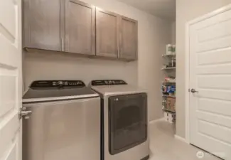 Nice sized laundry room with tons of storage space