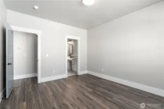 A tranquil primary suite offering generous space, elegant finishes, and abundant natural light for the ultimate retreat