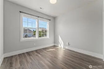 Bright and spacious, the three bedrooms impresses with durable LVP flooring and sophisticated designer paint, creating a welcoming sanctuary