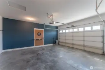 This spacious attached garage is fully finished for a clean, polished look—perfect for parking, storage, or a home workshop