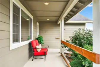 Large front porch with mature plantings in the front yard. A nice place to sit and relax.