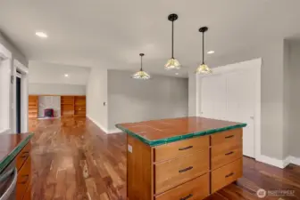 Large island with seating area defines the kitchen space while also having a seating area and space to spread out.