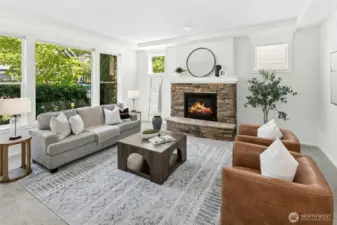 A stone fireplace anchors this room offering warmth and a place to gather.