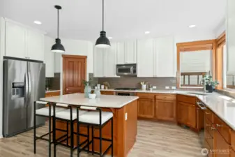 The sellers also added new drop lighting that connects well with other  lighting in the adjoining rooms.
