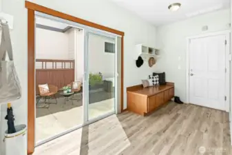 Check out the large mudroom off of the courtyard and garage entry ! A built-in bench with storage and hooks galore make this both beautiful and hard working!