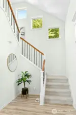 The staircase to the upstairs is a classic beauty - light filled windows grace the way up!