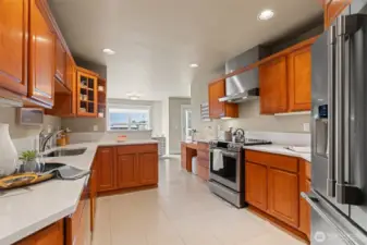 Kitchen with Quartz counters and stainless appliances.
