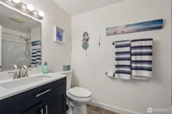 Updated full bath. Three baths total. Full, 3/4 off the primary & a 1/2 bath off the utility room.