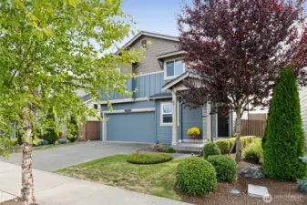 Front of Home with Beautiful Landscape