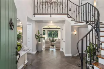 Soaring ceilings and grand staircase greet you in the foyer.