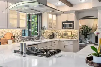 Enjoy cooking on gas stove and efficient overhead hood vent.
