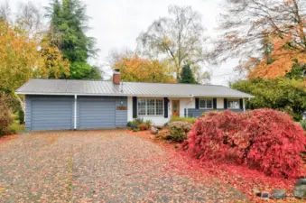 Front view with plenty of parking in the driveway