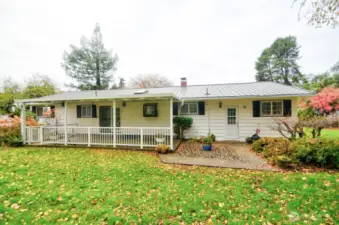 Back view showing covered patio