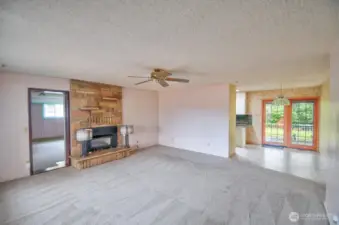 Entering the home you will find the spacious living room with a propane fireplace
