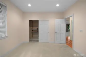 Comfortable second bedroom featuring brand new carpet and a custom-designed closet system...fresh, functional, and ready to make your own.
