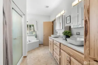 Jetted Tub, Floating Sinks, Custom Light Fixtures and Water Closet