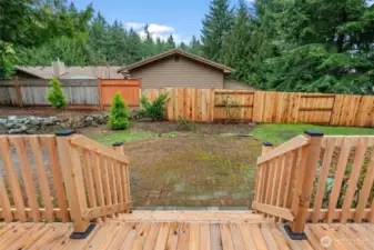 New wrap around deck with stairs down to paver patis