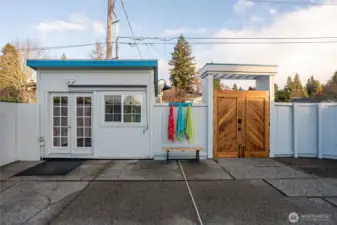 Pool cabana next to the beautiful wood entrance gate.