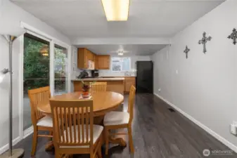 Large sliding glass door leads to backyard patio.