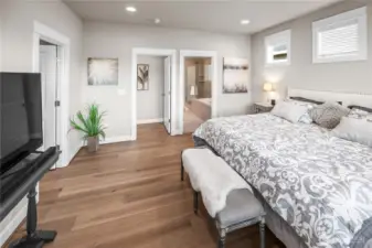 The generously sized primary suite has a large walk in closet and a grand bathroom.