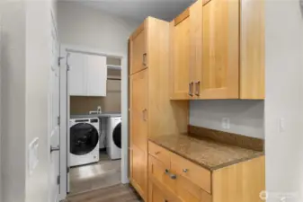 Here's another part of the kitchen with a computer desk. Garage is to the left and laundry room straight ahead.