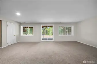 Huge bonus room downstairs that opens out to the backyard.  There's a 5th bedroom down here and also a rubber-floored exercise room.