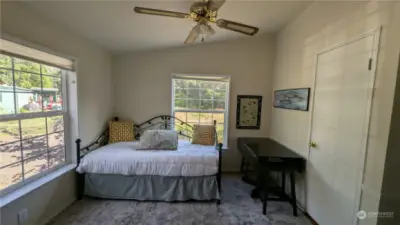 Light filled bonus room/den with closet and french doors out to the living area.