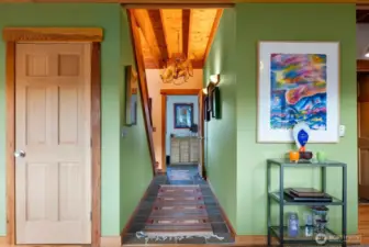 Hallway from the entry foyer to Living room and all. Bright sunny naturl light.