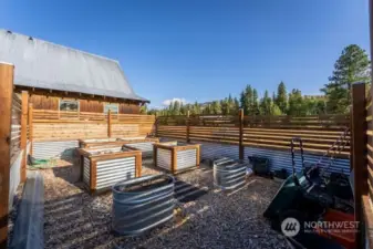 Well built Raised bed garden area. Fenced. Irrigation water to make your garden grow.