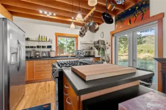 Kitchen has ample counter top areas for working on good food for friends and guests!