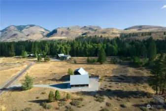 2.06 Acres has convenient driveway off of Cottonwood Drive. Groomed Ski / Methow Trail is mere steps away from this home.