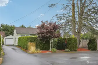 Long driveway on the side of the home with a wide gate. very spacious