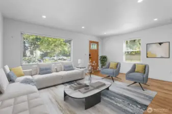 Natural light pours through the large picture window in the living room, brightening every detail. Virtually staged.