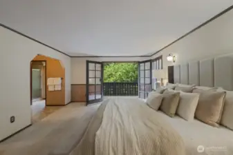 The french doors in the primary suite open up to a charming balcony and welcomes in the lush green surroundings. Leave open and listen to the birds sing. There's so much privacy!