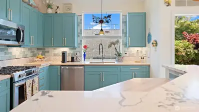 Quartz countertop on island and new butcher block kitchen counters