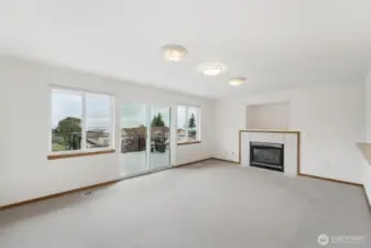 Living room just off the kitchen with deck access.  Perfect for entertaining!
