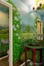 Powder room with hand-painted mural