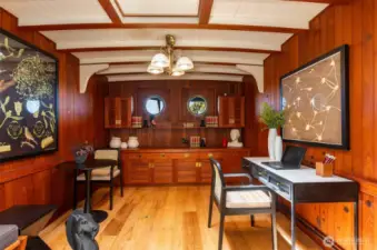 Check out this great office/den/Speakeasy on the main floor! Reminiscent of a ships stateroom, this cozy spot is  very inviting.