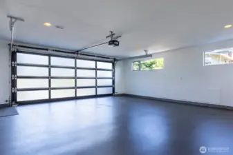Main level attached  2-car garage. The other attached 2-car garage is accessed via a lower driveway.