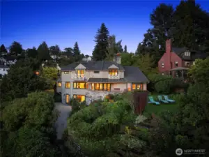 Originally built in 1946 and thoughtfully renovated over the past decade, this 4,150 square foot stone and cedar home exudes storybook charm and classic elegance at every turn.