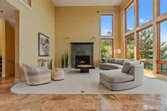 Living room with floor to ceiling windows.