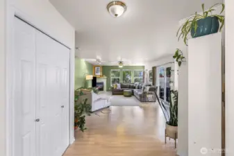 Entry way with large coat closet looking towards the spacious living room.