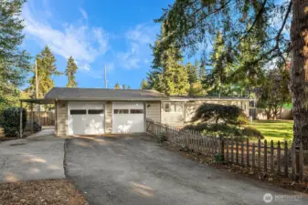 Welcome home to this conveniently located 2 bedroom home with 2 car garage, paved driveway, and plenty of parking.