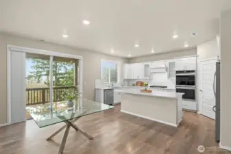 Chef's kitchen with eat-in counter space and tons of light!